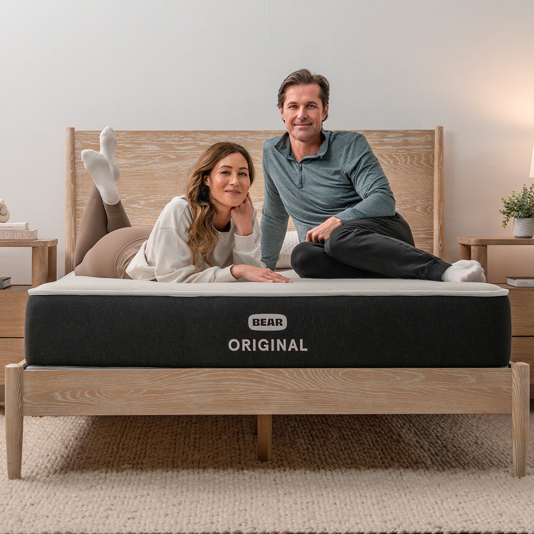 Couple lounging on Bear Original mattress