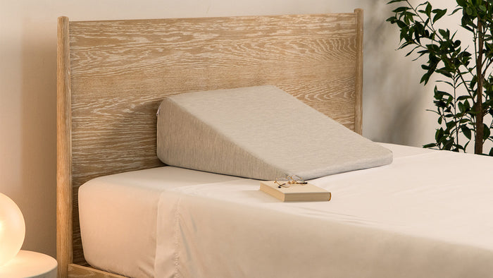 Wedge pillow on bed